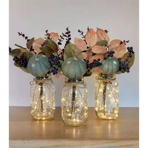 Mason Jars Filled with Pumpkins and Leaves