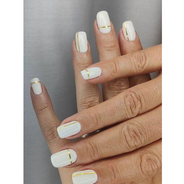 White Nails with Gold Stripes
