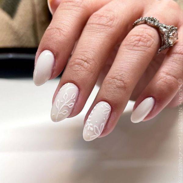 White Nails with Floral Embellishments
